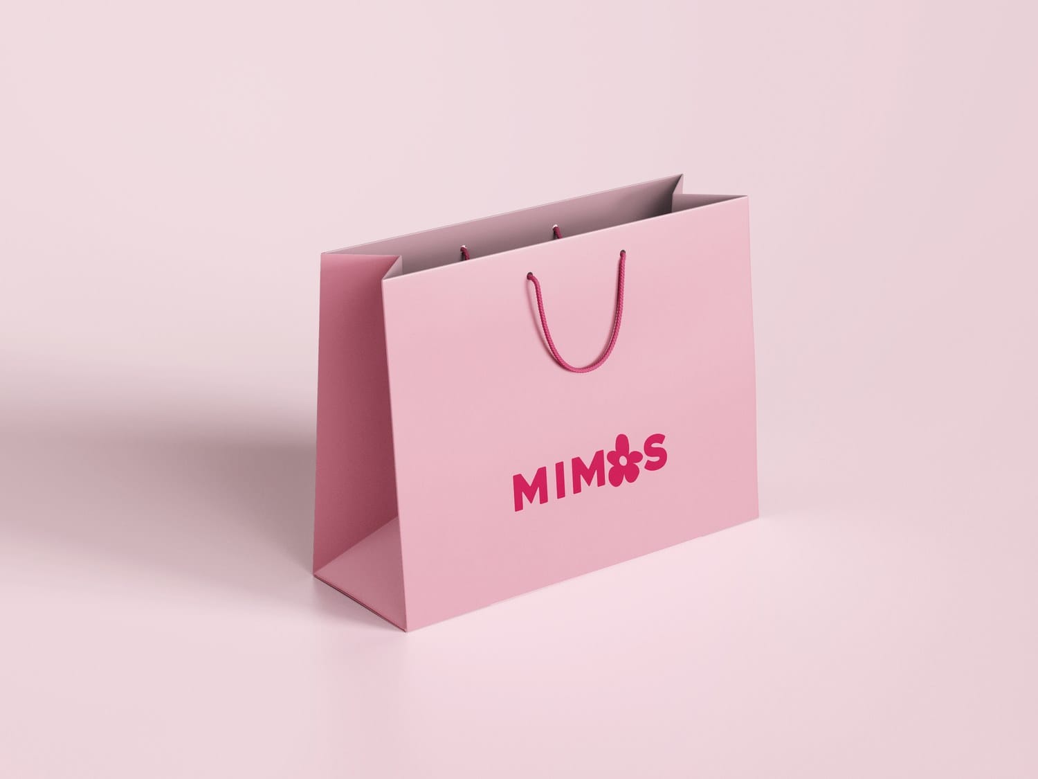 Pink shopping bag with the Mimos wordmark in magenta