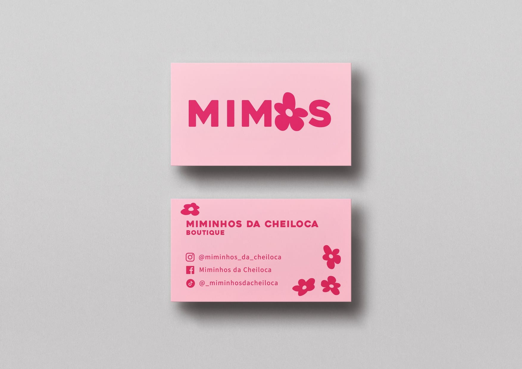 Pink business cards: Mimos wordmark on the front, boutique contact details on the back