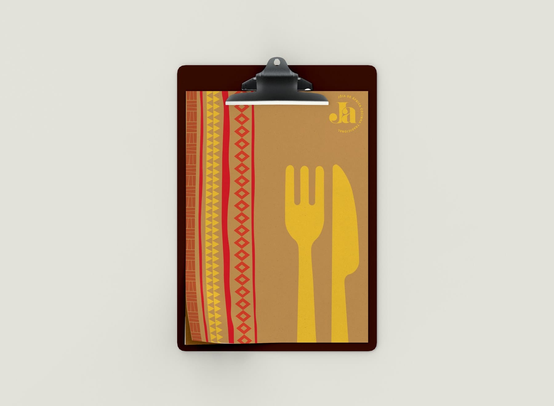 Menu on a clipboard with the striped pattern and a yellow fork and knife
