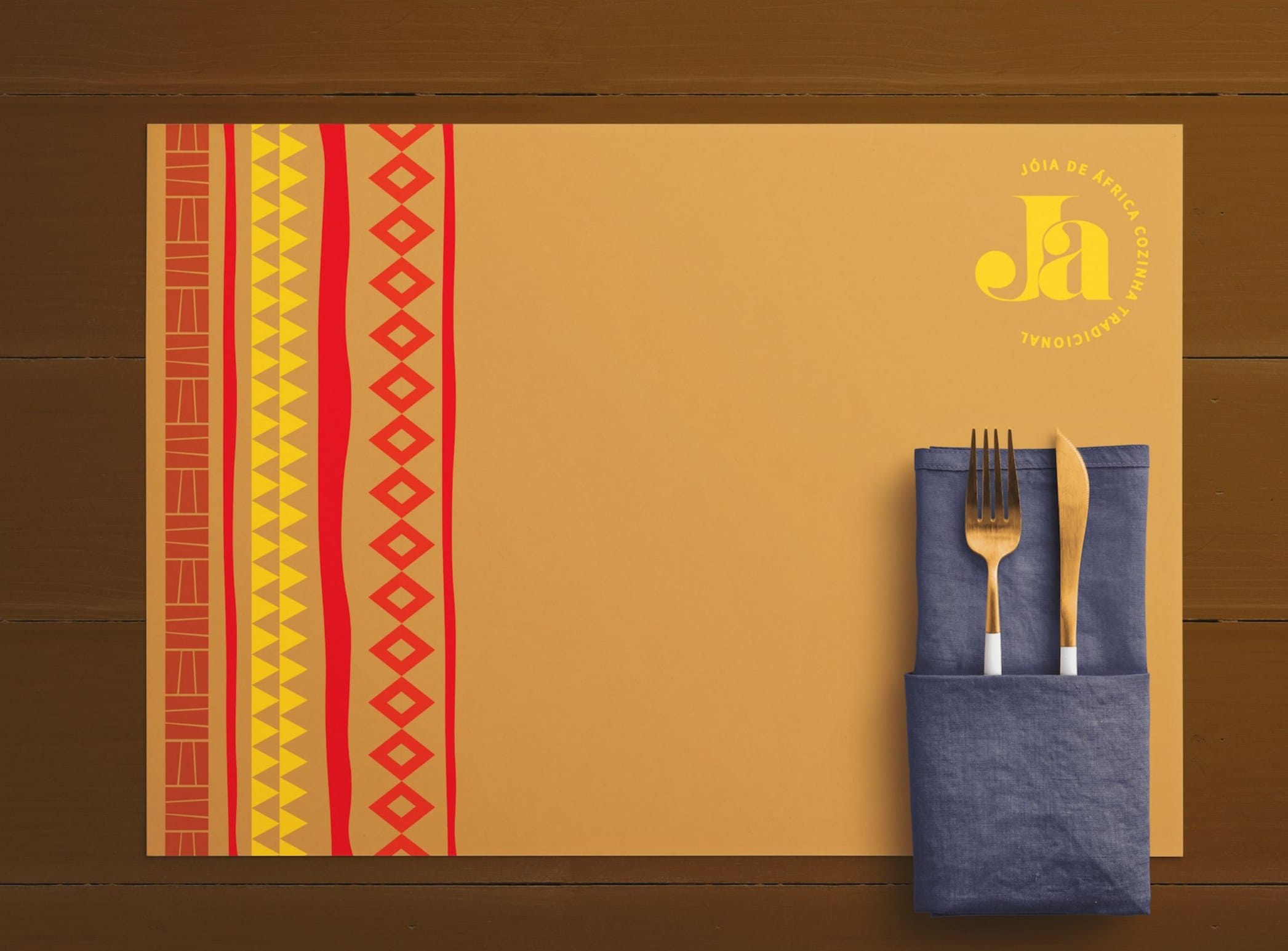 Place mat mockup with the striped pattern and the circular mark, cutlery in a denim pouch