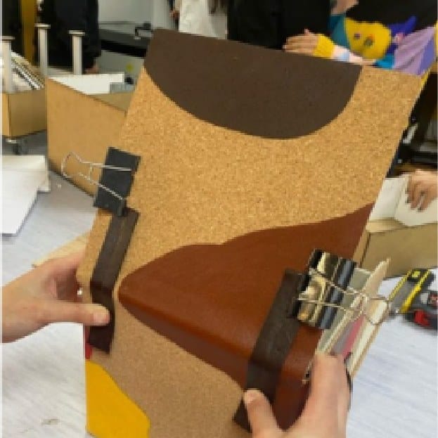 Fitting a leather strap and buckle to the cork-covered box
