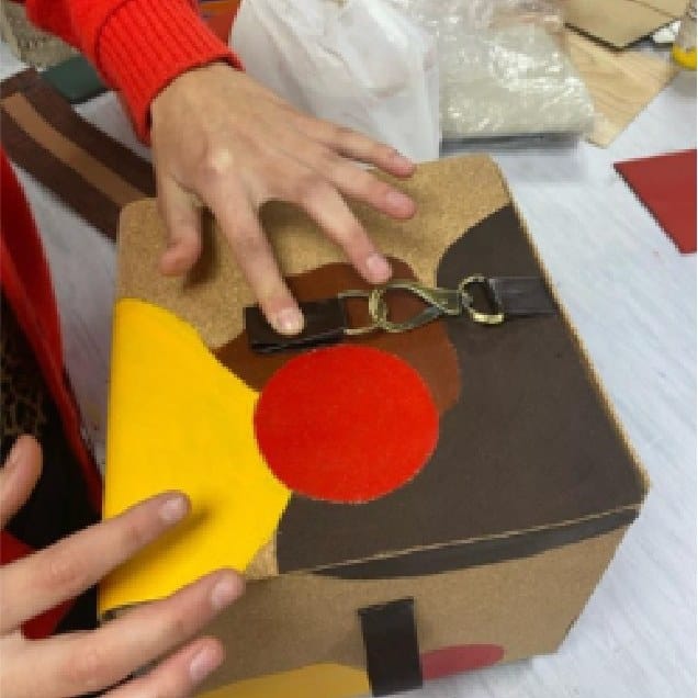 Pressing a painted panel onto the box during assembly