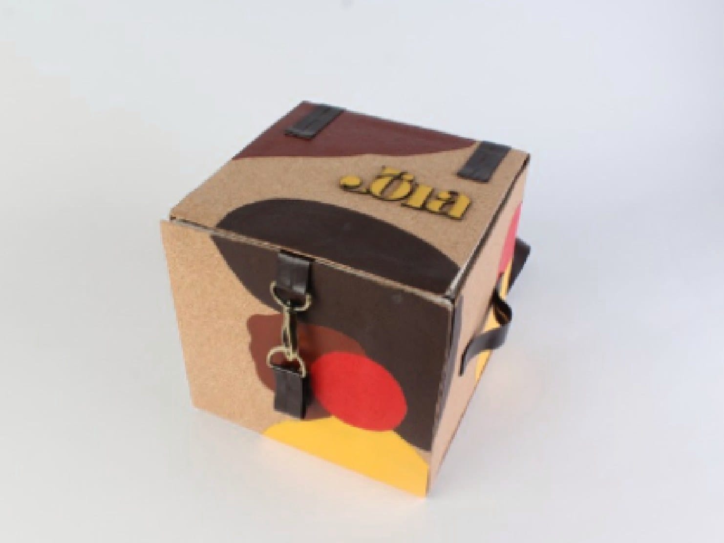 Finished prototype: closed cork box with painted shapes and the Jóia logo on the lid