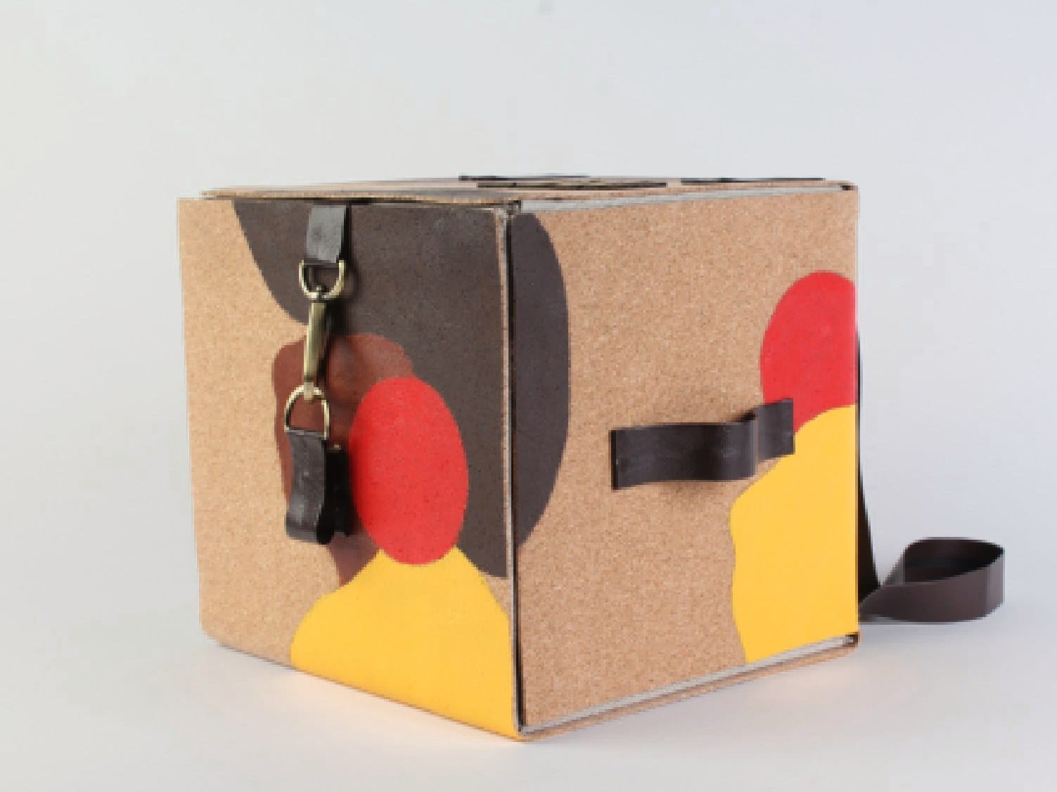 Finished prototype from the side with leather straps and buckle