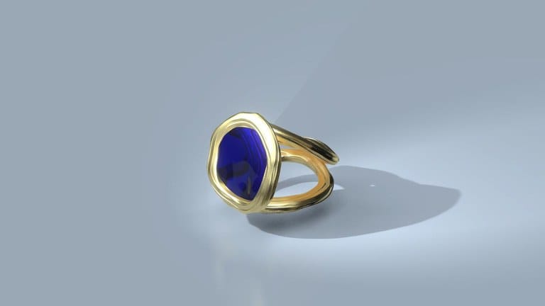 3D render: a gold ring with an oval blue stone